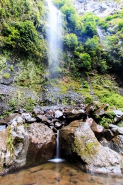 Waterfalls into still water